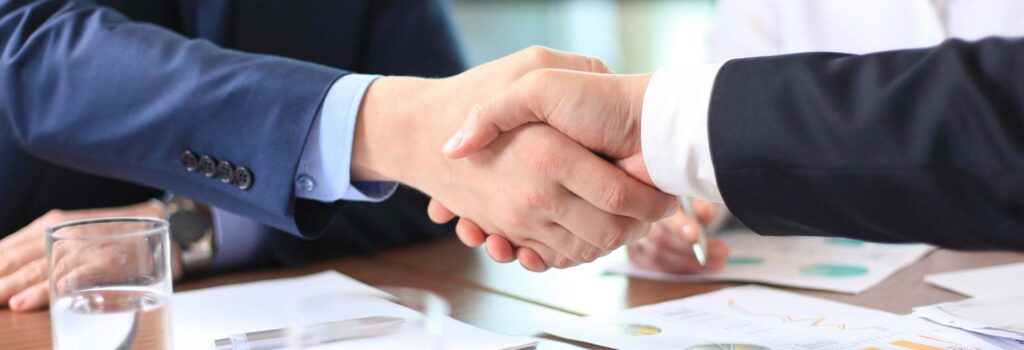 Shaking hands with commercial project client